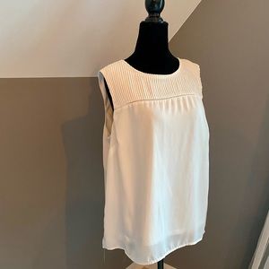Sleeveless white shell size L